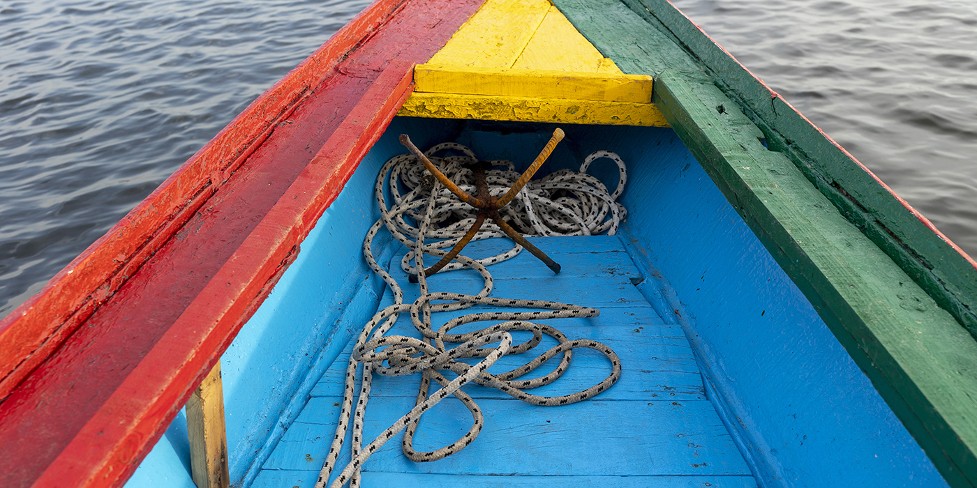 Anchor on a boat painted with the colors of the national flag on