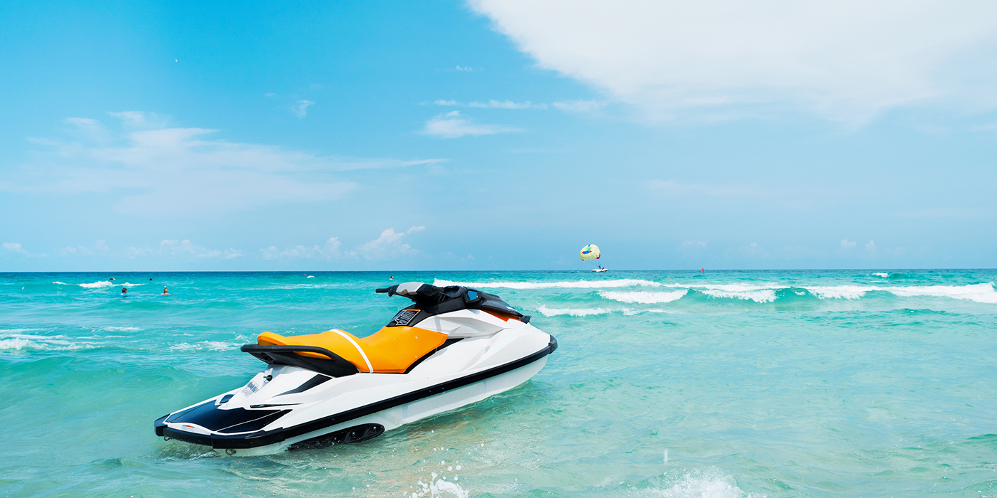 Blue sea and a jet ski floating on the sea, with a blue sky back
