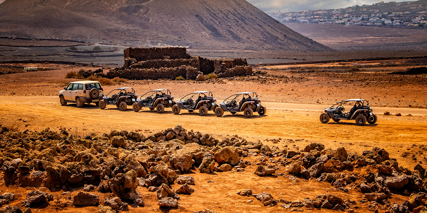Several buggies are in line on Wonderful desert landscape.
