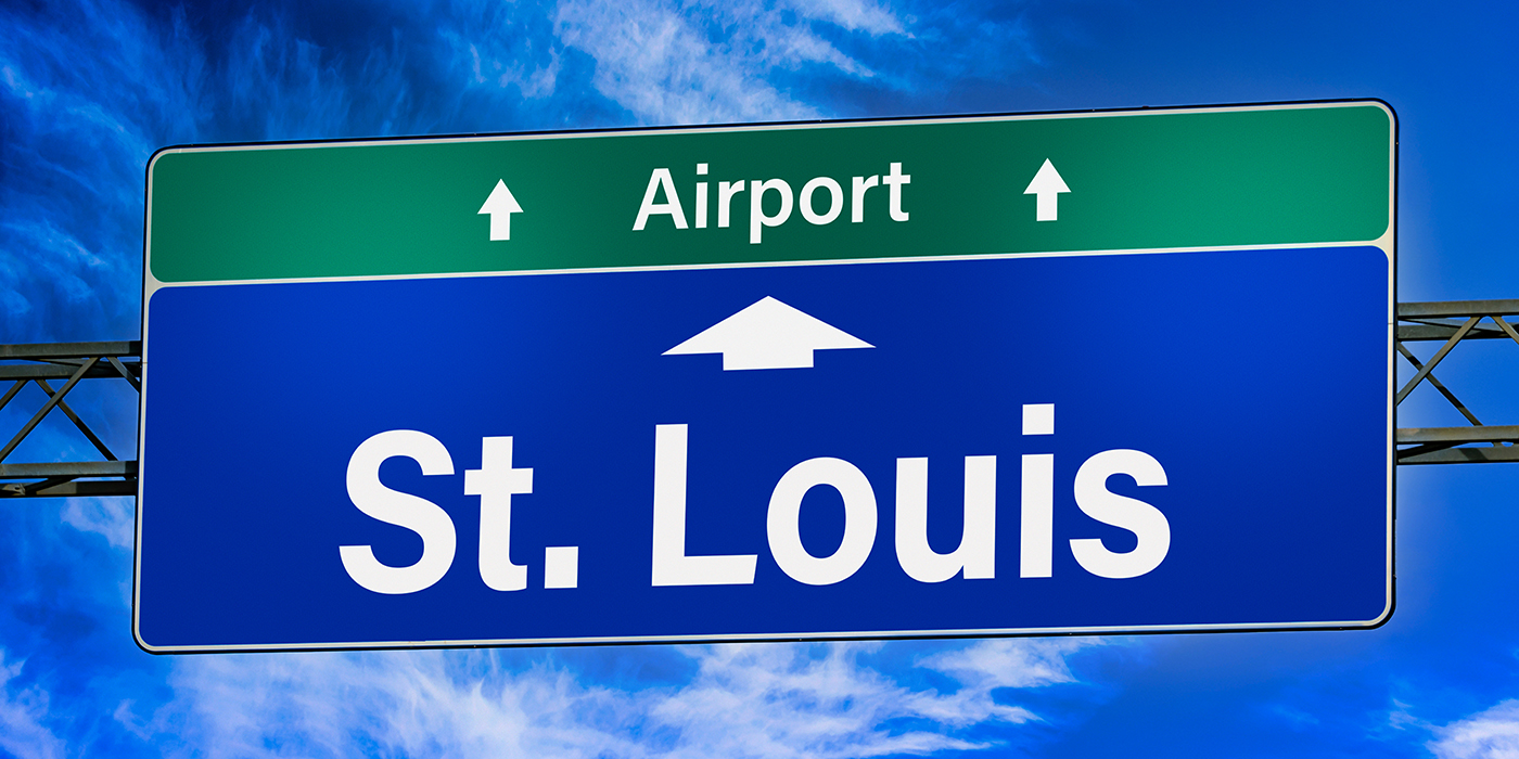 Road sign indicating direction to the city of St. Louis