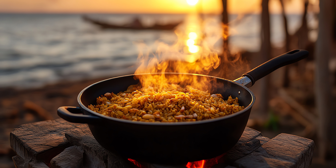 A Senegalese yassa dish, steaming hot, set on a rustic table in